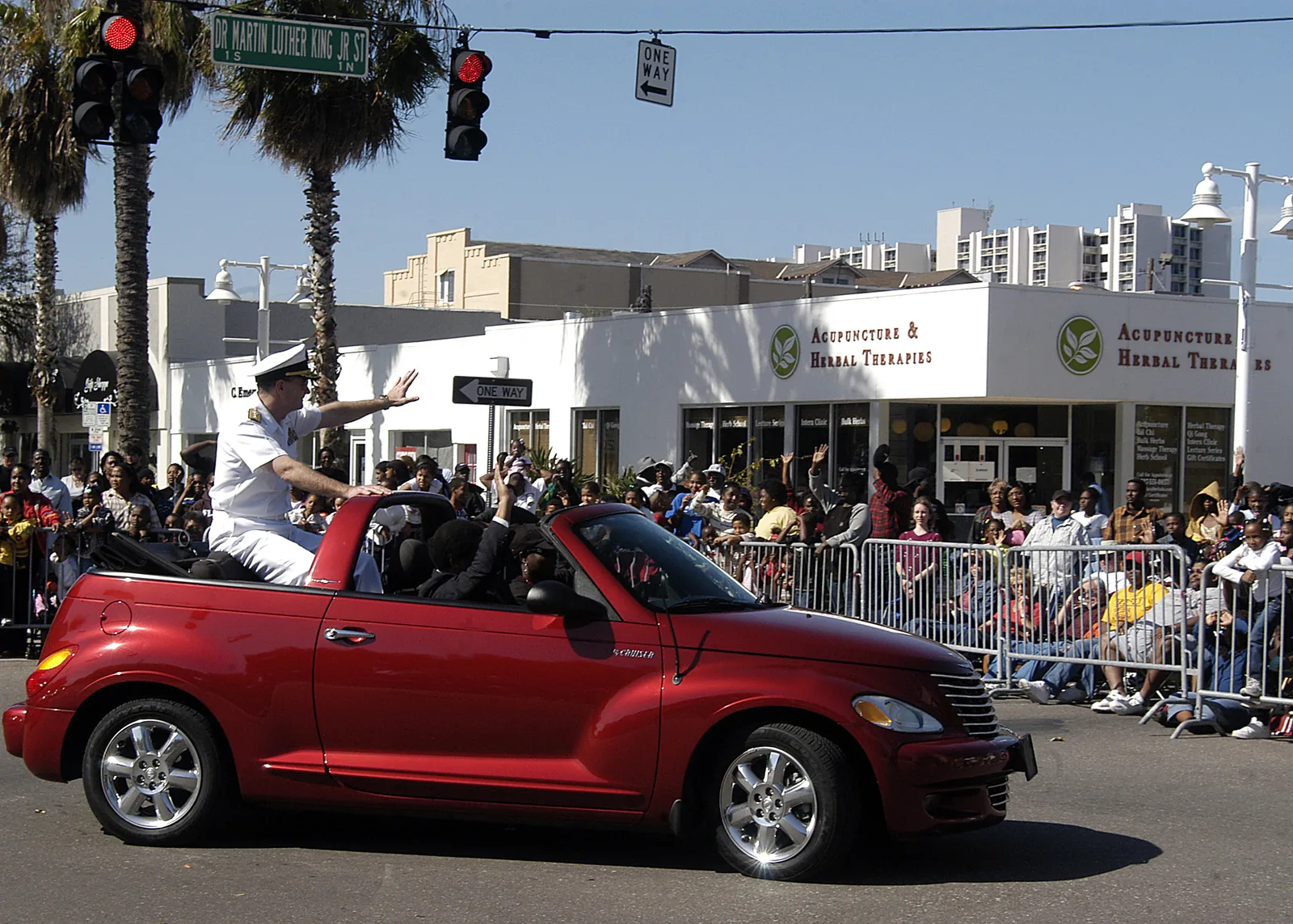 Spectators line Dr. Martin Luther King Jr. Street South in St. Petersburg as a parade entry rides by during the city's MLK Day parade.
