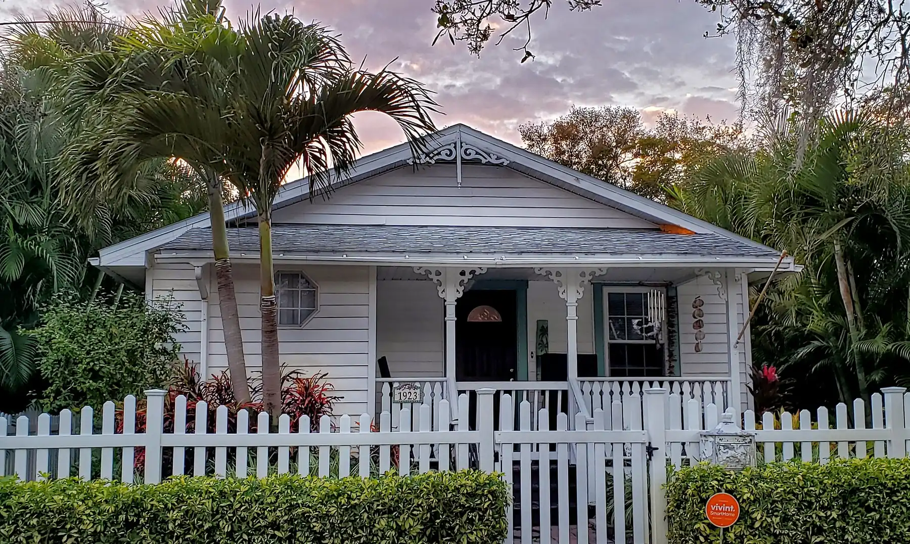 A cottage behind a white picket fence in the Old Southeast neighborhood of St. Petersburg.