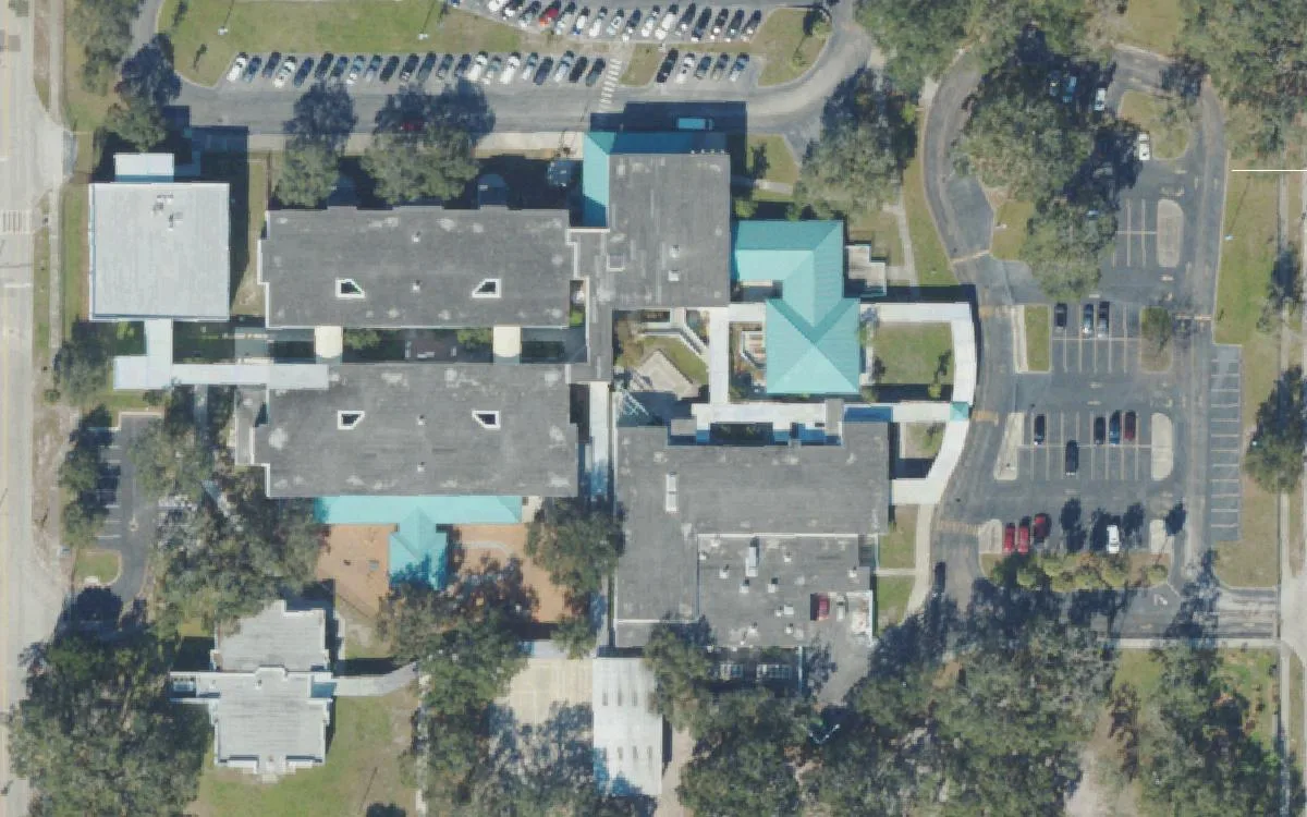 James B. Sanderlin K-8's teal-roofed school buildings on 22nd Avenue South in St. Petersburg seen from the air.