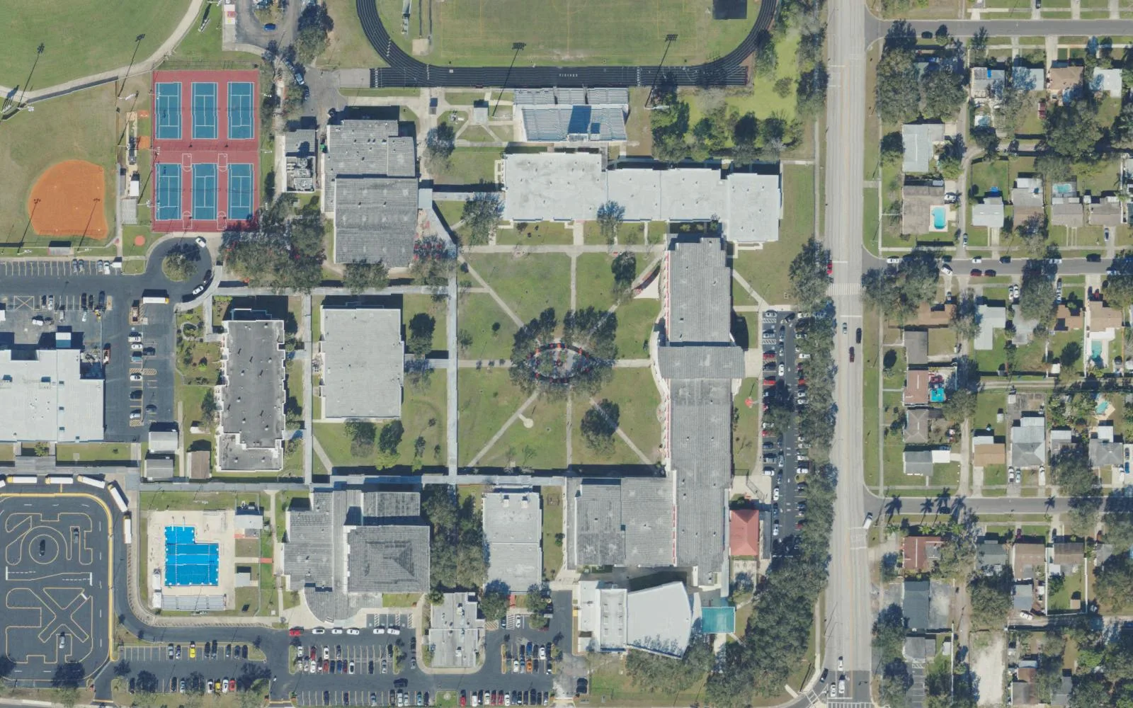 Northeast High School's campus on 16th Street North in St. Petersburg seen from the air, with its pool, tennis courts and ball field.
