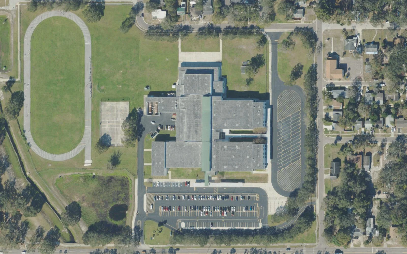 Thurgood Marshall Fundamental Middle School's campus on 22nd Avenue South in St. Petersburg seen from the air, with its track to the west.