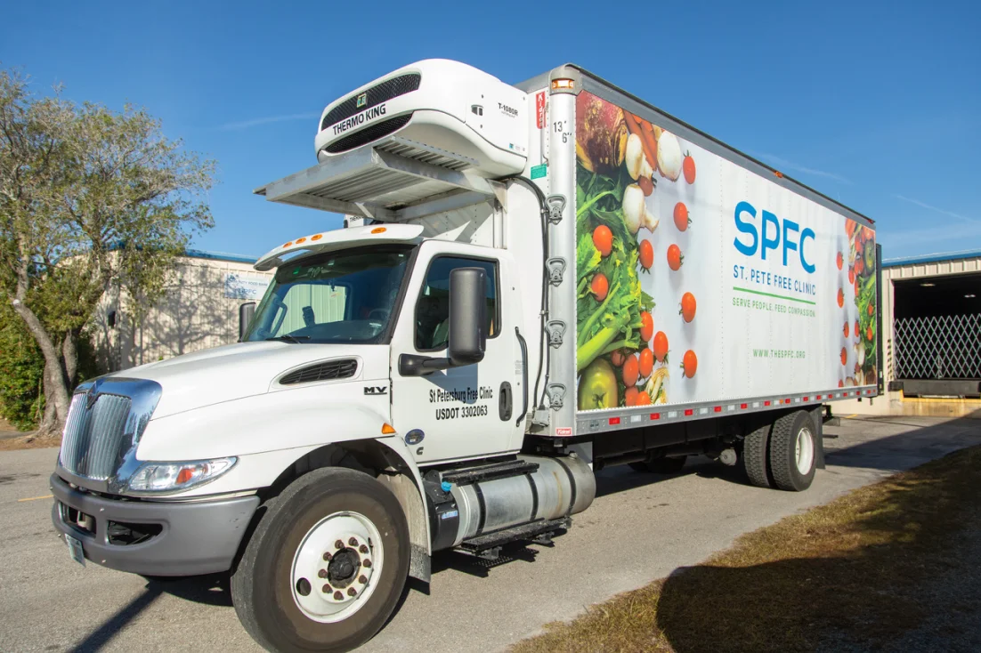 A St. Pete Free Clinic refrigerated food truck outside the nonprofit's warehouse.